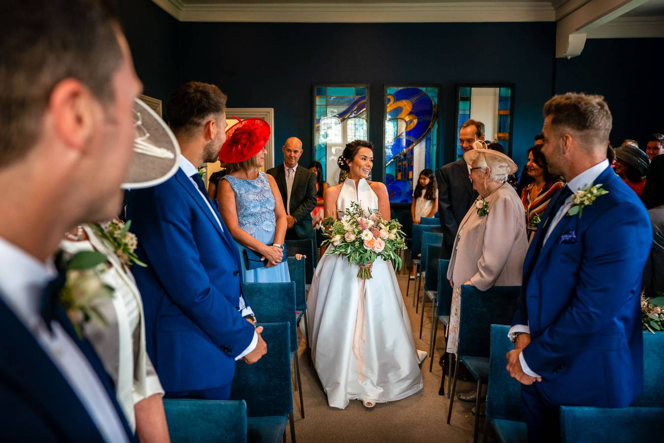 The Castle Room at Winchester Registry Office. Bride walking down the aisle on her own